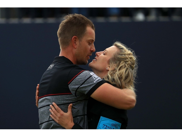 TROON, SCOTLAND - JULY 17: Henrik Stenson of Sweden kisses wife Emma in celebration after the winning putt during the final round on day four of the 145th Open Championship at Royal Troon on July 17, 2016 in Troon, Scotland. Henrik Stenson of Sweden finished 20 under for the tournament to claim the Open Championship. (Photo by Mike Ehrmann/Getty Images)