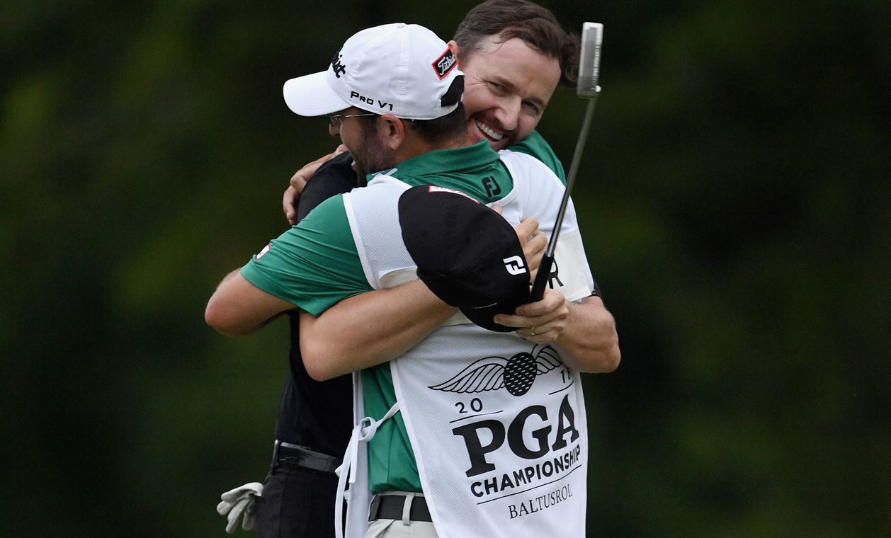 SPRINGFIELD, NJ - JULY 31: Jimmy Walker of the United States hugs caddie Andy Sanders after his putt for par on the 18th hole to win the 2016 PGA Championship at Baltusrol Golf Club on July 31, 2016 in Springfield, New Jersey. (Photo by Stuart Franklin/Getty Images)
