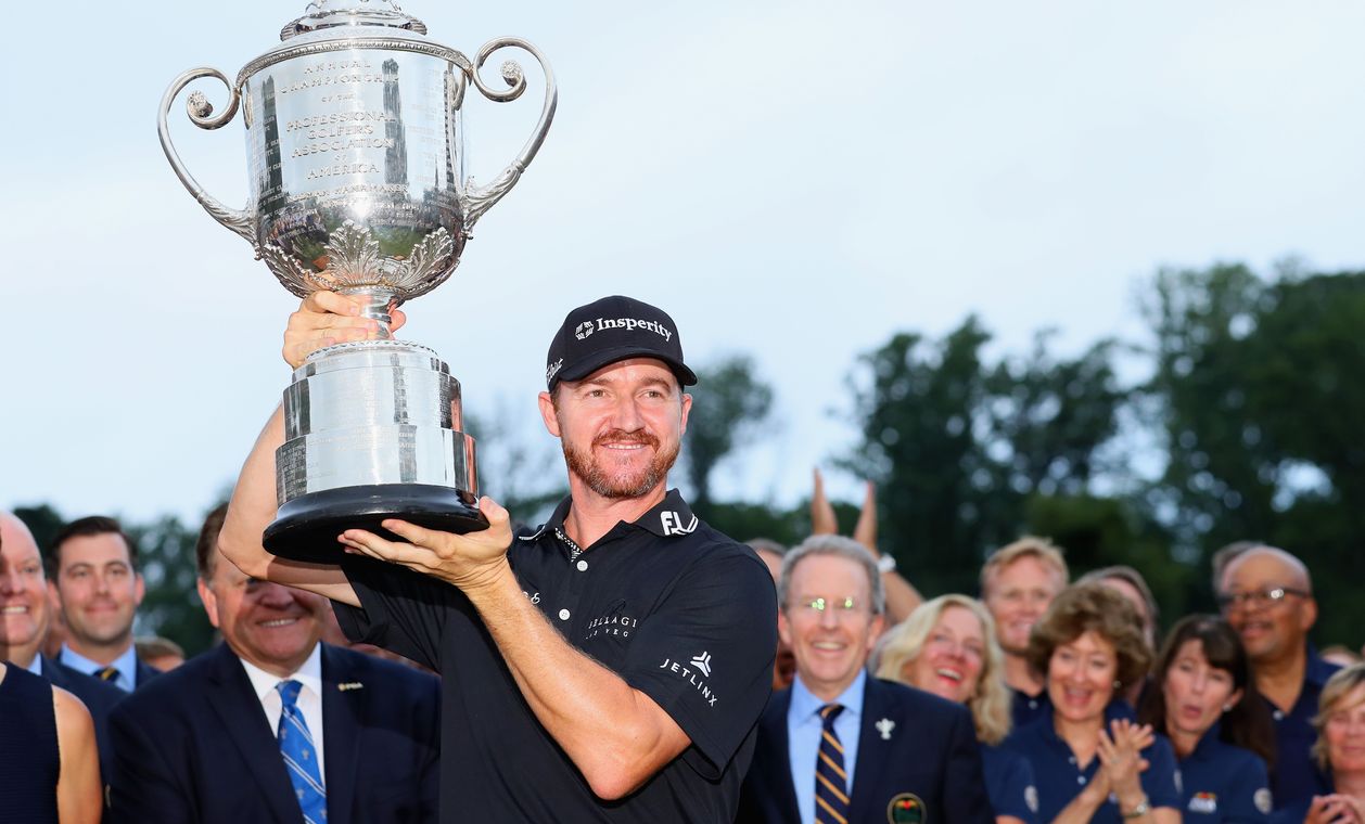 SPRINGFIELD, NJ - JULY 31: Jimmy Walker of the United States celebrates with the Wanamaker Trophy after winning the 2016 PGA Championship at Baltusrol Golf Club on July 31, 2016 in Springfield, New Jersey. (Photo by Andrew Redington/Getty Images)