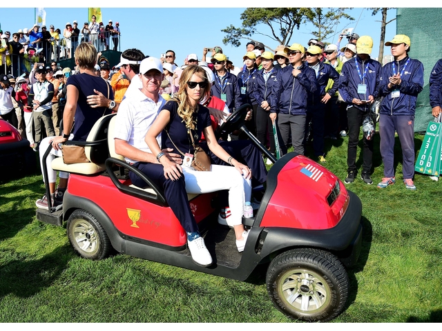 INCHEON CITY, SOUTH KOREA - OCTOBER 08: Jimmy Walker and Bubba Watson of the United States Team wait on a golf cart with their wives during the Thursday foursomes matches at The Presidents Cup at Jack Nicklaus Golf Club Korea on October 8, 2015 in Songdo IBD, Incheon City, South Korea (Photo by Harry How/Getty Images)