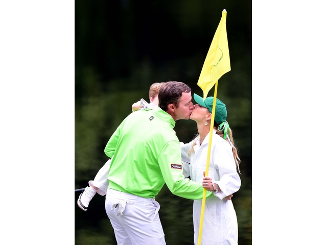 AUGUSTA, GEORGIA - APRIL 06: Jimmy Walker of the United States celebrates with wife Erin Stiegemeier and child during the Par 3 Contest prior to the start of the 2016 Masters Tournament at Augusta National Golf Club on April 6, 2016 in Augusta, Georgia. (Photo by Harry How/Getty Images)