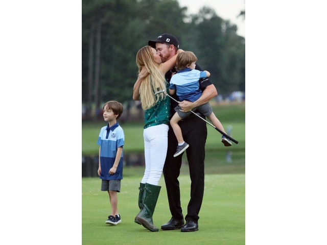 SPRINGFIELD, NJ - JULY 31: Jimmy Walker (2nd L) of the United States embraces his wife Erin (2nd L) and his son Beckett (R) alongside son Mclain (L) on the 18th hole after winning the 2016 PGA Championship at Baltusrol Golf Club on July 31, 2016 in Springfield, New Jersey. (Photo by Andrew Redington/Getty Images)