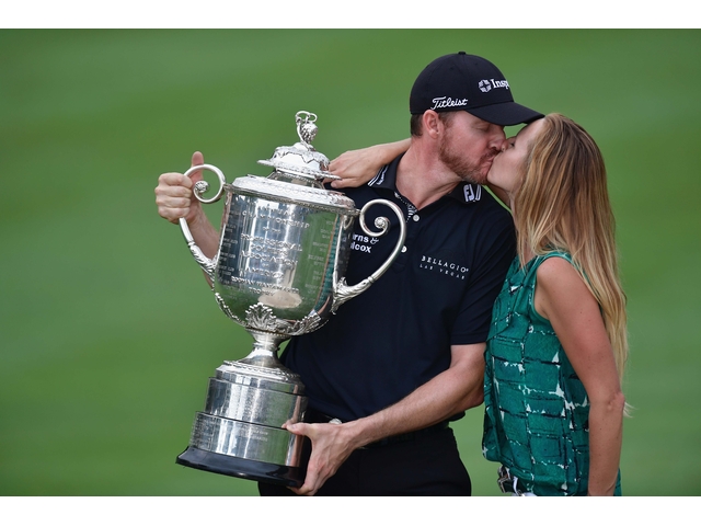 SPRINGFIELD, NJ - JULY 31: Jimmy Walker (L) of the United States kisses his wife Erin (R) while holding with the Wanamaker Trophy in celebration of his victory during the 2016 PGA Championship at Baltusrol Golf Club on July 31, 2016 in Springfield, New Jersey. (Photo by Stuart Franklin/Getty Images)
