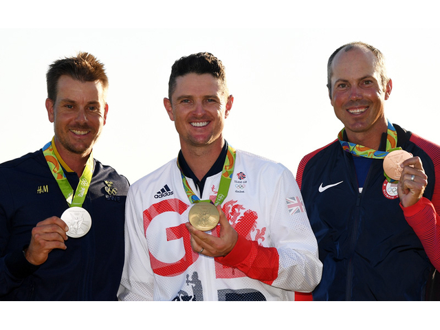 RIO DE JANEIRO, BRAZIL - AUGUST 14:  Justin Rose (C) of Great Britain celebrates with the gold medal, Henrik Stenson (L) of Sweden, silver medal, and Matt Kuchar of the United States, bronze medal, after the final round of men's golf on Day 9 of the Rio 2016 Olympic Games at the Olympic Golf Course on August 14, 2016 in Rio de Janeiro, Brazil.  (Photo by Ross Kinnaird/Getty Images)